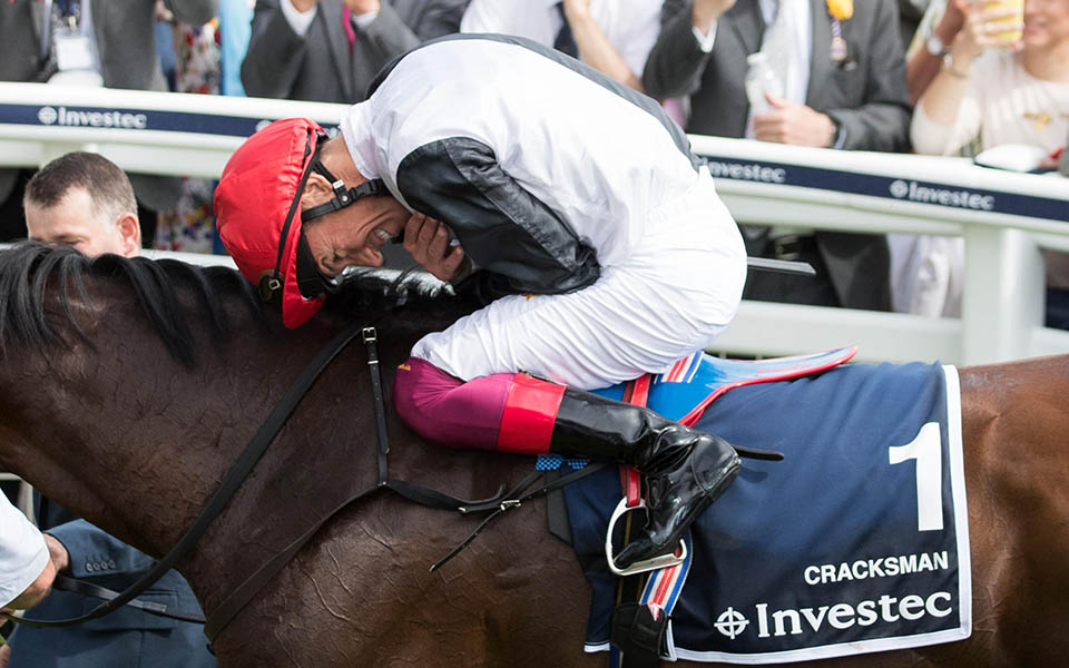 Jockey Frankie Dettori celebrates winning the Investec Coronation Cup on Cracksman during ladies day of the 2018 Investec Derby Festival at Epsom Downs Racecourse